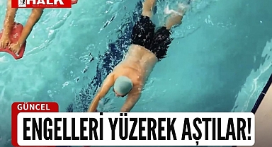 Engelleri yüzerek aştılar!