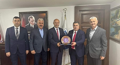 Başkanlardan Başkana Plaket