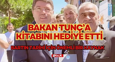 BAKAN TUNÇ'A KİTABINI HEDİYE ETTİ