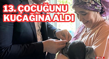 13. Çocuğunu Kucağına Aldı